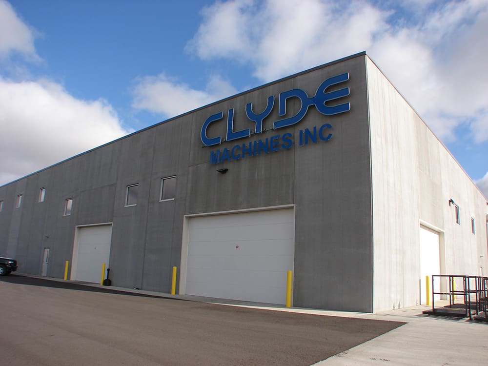 A large, gray industrial building with 